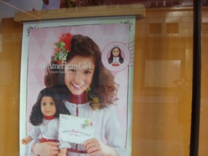 American Girl doll store poster in the window